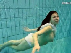 TubeHardcore presents: Girl in white panties swims in pool