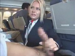 TubeHardcore presents: Stewardess gives a handy j on plane