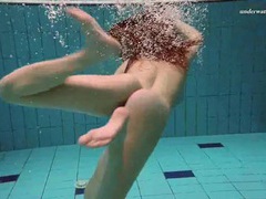 TubeHardcore presents: Underwater with a busty naked babe as she swims